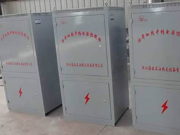 Three middle frequency power control cabinets on the ground.