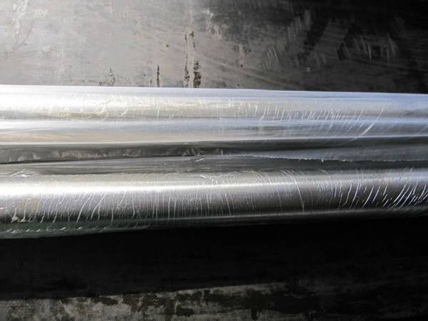Two polished rod covered by the plastic film.