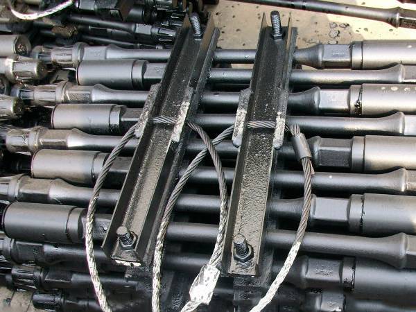 A bundle of sucker rod is packaged by the angle steel and bolts.